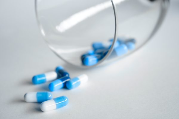 A photograph of blue and white medical pills