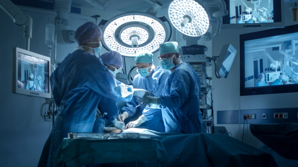 A medical team performing an operation in a modern operating room.