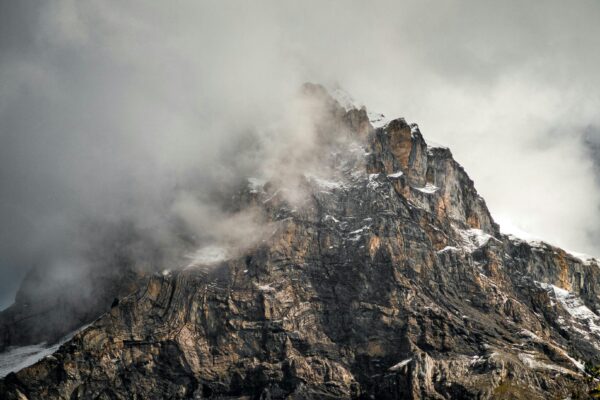 A storm approaches a mountain peak, representing the volatile insurance market in Q4 2024.